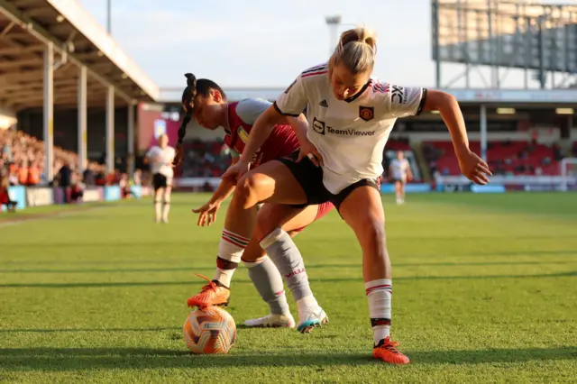 Alessia Russo battles for the ball.
