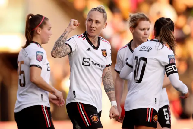 Leah Galton celebrates with the United fans.