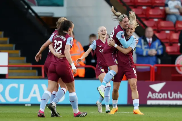 Villa celebrate their second goal.