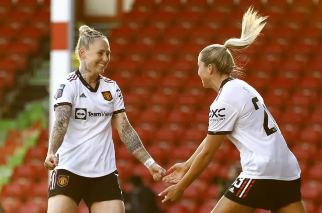Leah Galton and Alessia Russo celebrate United's equaliser.