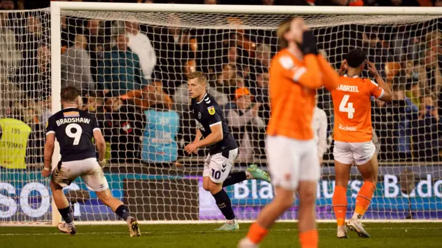 Zian Flemming celebrates his goal for Millwall against Blackpool