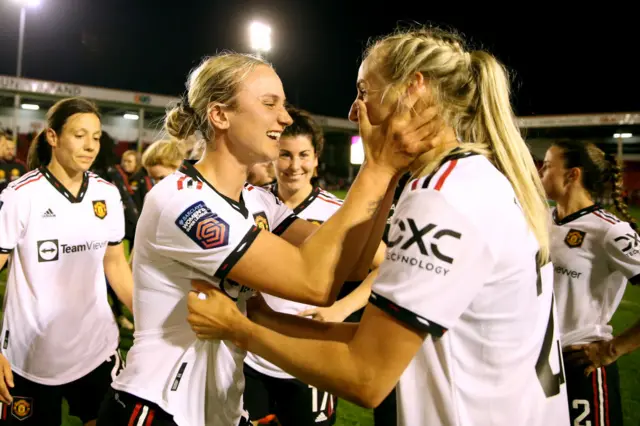 Man United's players celebrate with matchwinner Millie Turner.