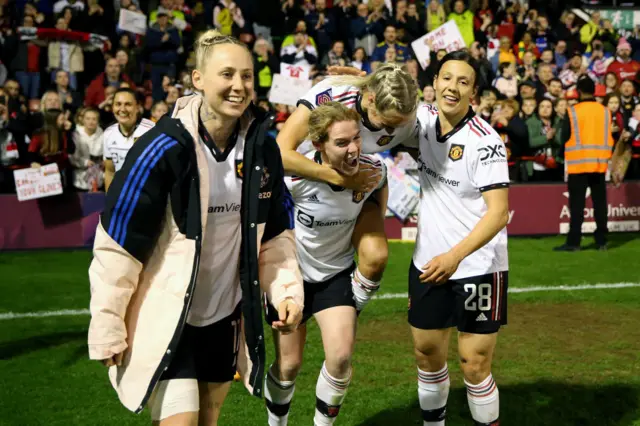 United players celebrate in front of their fans.