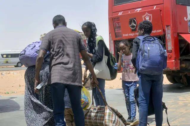 Citizens are seen upon their arrival in Egypt's Argeen Land port border crossing gate following their evacuation process from Sudan