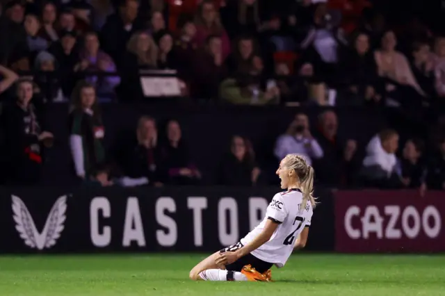 Millie Turner celebrates with the United fans.