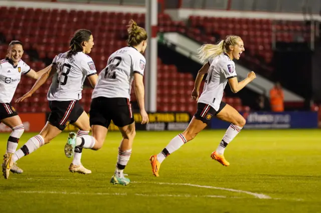 Millie Turner wheels away after scoring the winner.