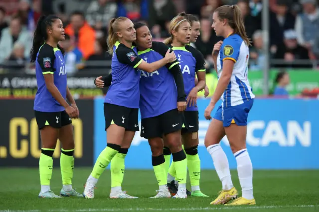 Tottenham players celebrate a goal during 8-0 win over Brighton in WSL