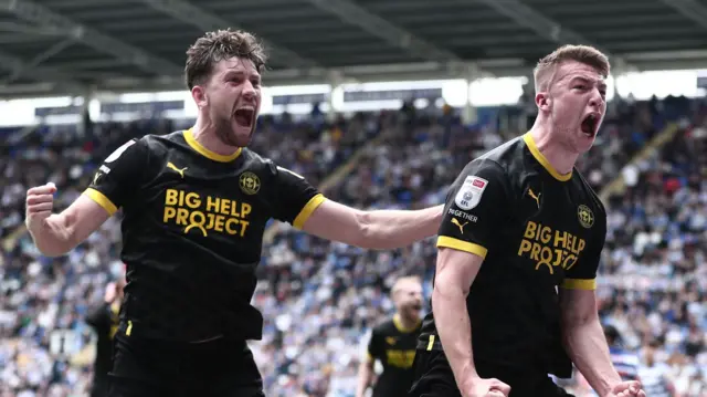 Wigan's Charlie Hughes celebrates scoring at Reading