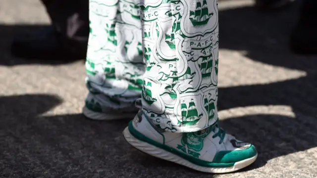 A Plymouth fans wears special trousers and shoes