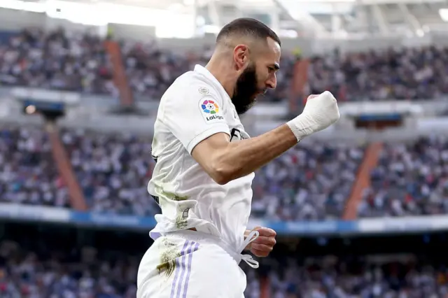 Karim Benzema celebrates his third goal v Almeria.