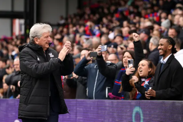 Roy Hodgson applauds the Palace fans.