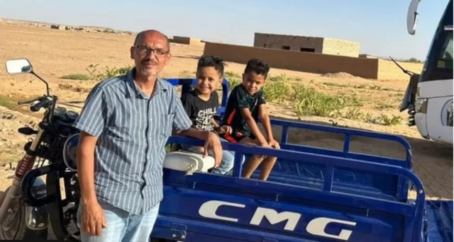 Fadi Atabani and two of his children