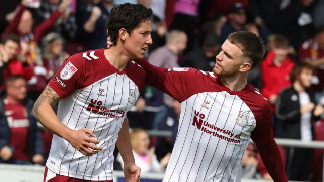 Northampton players celebrate a goal