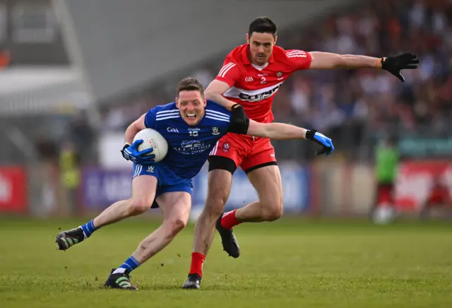 Derry's Chrissy McKaigue challenges Monaghan's Conor McManus