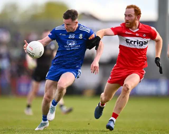 Karl O'Connell of Monaghan in action against Conor Glass of Derry