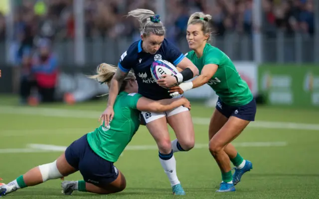 Scotland's Chloe Rollie against Ireland's Aoife Doyle and Aoife Dalton