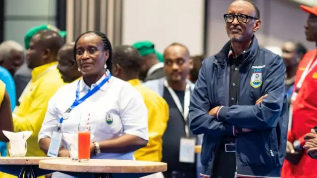 Consolee Uwimana left and President Paul Kagame