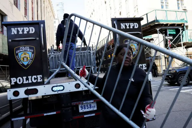 Security barriers were pictured being put in place yesterday outside the Manhattan Criminal Court, where Trump will appear on Tuesday