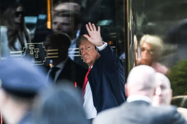 Former President Donald Trump enters Trump Tower