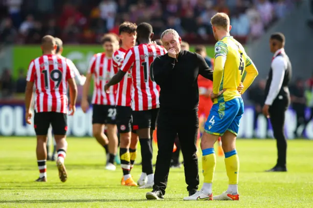 Steve Cooper and Joe Worrall at full-time at Brentford