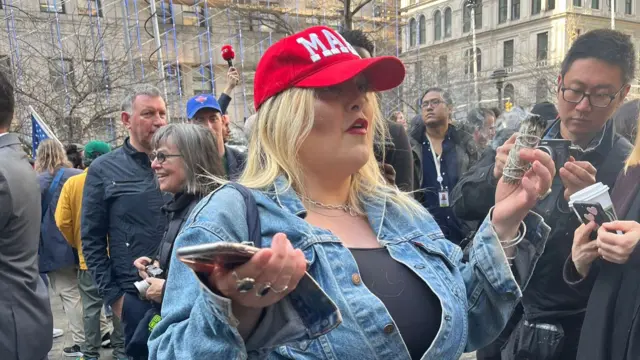 Trump supporter carrying sage stick