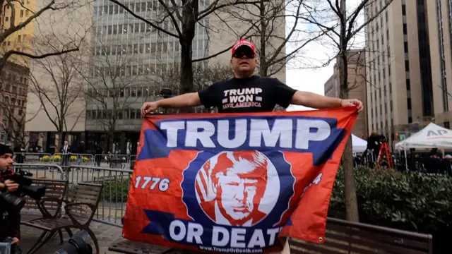 Dion shows his support with his flag in New York