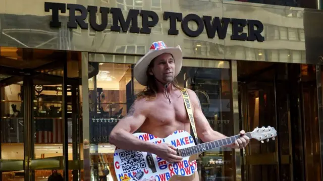 The Naked Cowboy outside Trump Tower