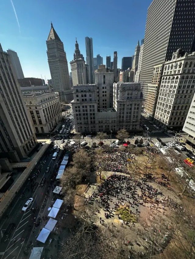 A aerial view of protsters in front of the courthouse