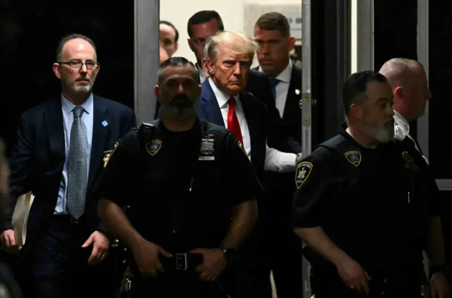 Donald Trump enters courtroom in Manhattan.