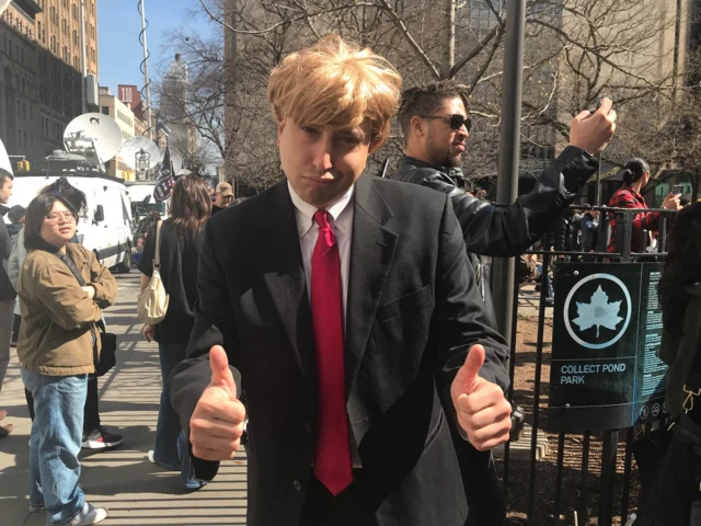 US comedian Jason Scoop dressed as Donald Trump