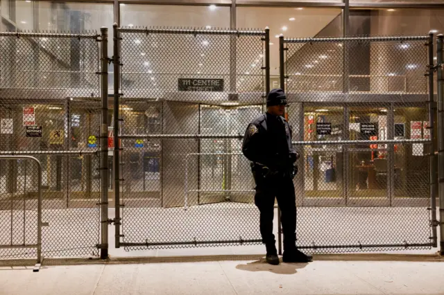 A law enforcement officer works near the Manhattan Criminal Courthouse