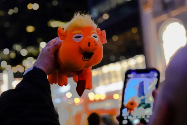 A plush toy depicting former U.S. President Donald Trump as an orange pig outside Trump Tower