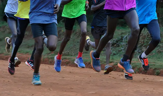 Kenyan athletes run during a training session in Iten