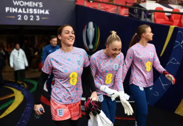 England goalkeepers enter the pitch to warm up.