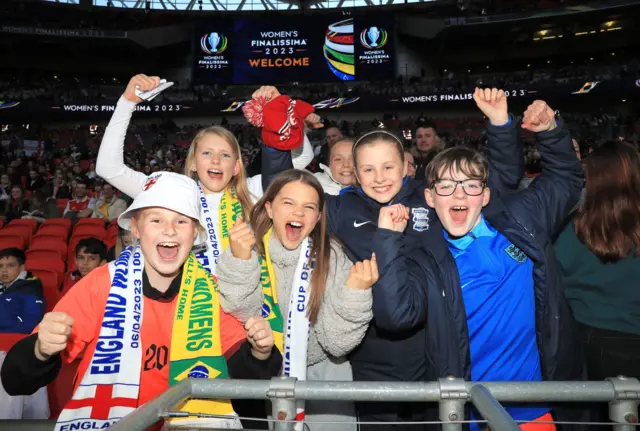 England fans cheer on the side.