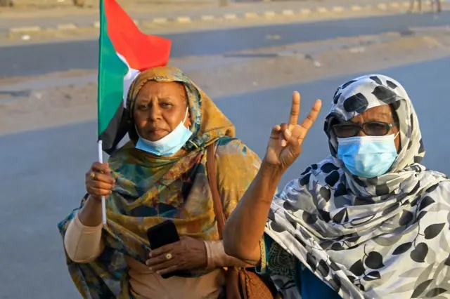 Protesters with Sudan flag