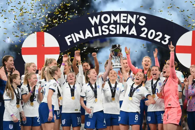 England captain Leah Williamson lifts the Finalissima trophy aloft.