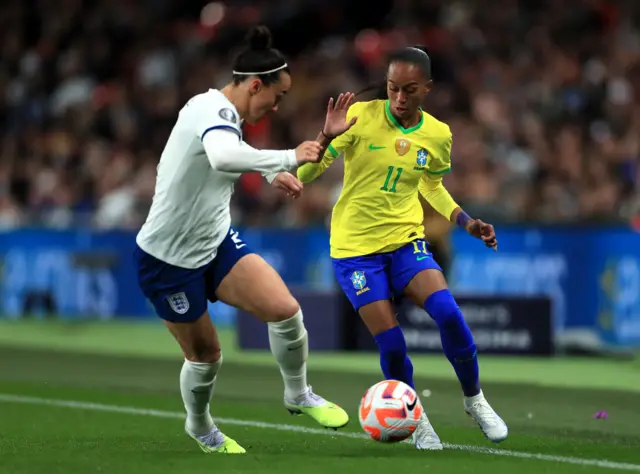 Brazil winger Adriana runs forward.