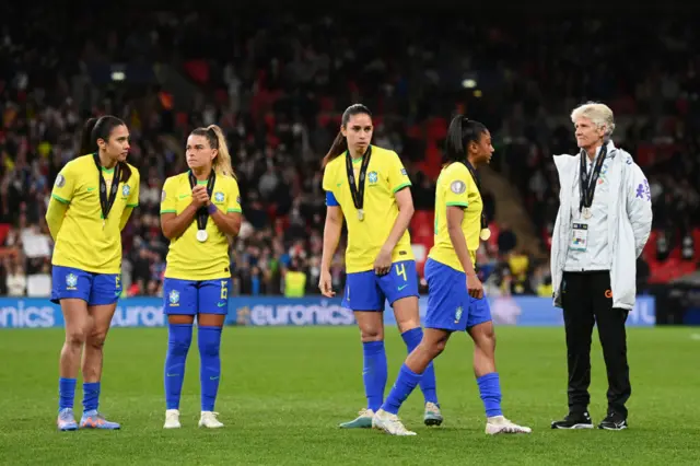 Brazil players commiserate after losing the Finalissima.