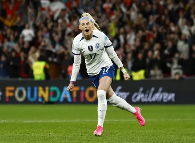 Chloe Kelly celebrates scoring the winning penalty.