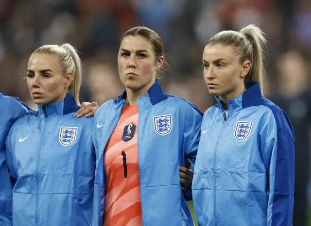 England line up for the national anthem.