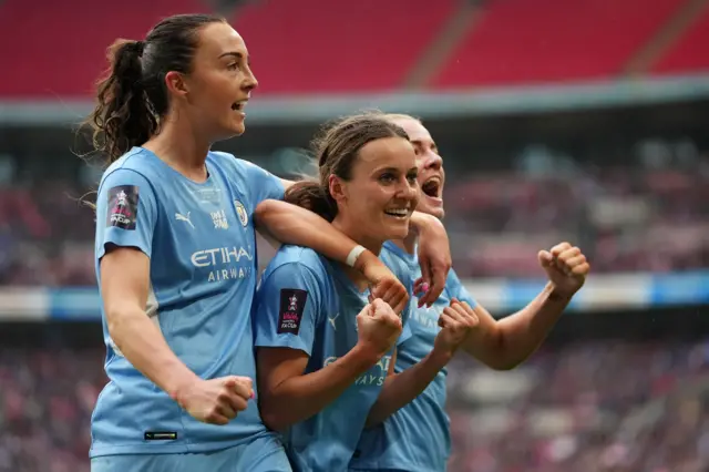 Caroline Weir and Hayley Raso celebrate with Manchester City