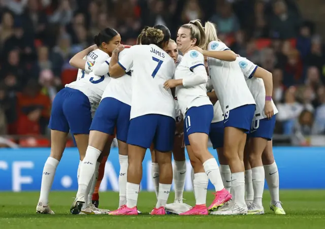 England squad come into a huddle before kick-off.