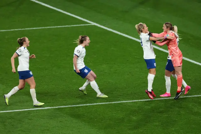 England players celebrate with Mary Earps.