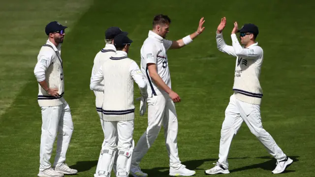 Middlesex celebrate Tom Helm taking the wicket of Essex's Dan Lawrence for 105