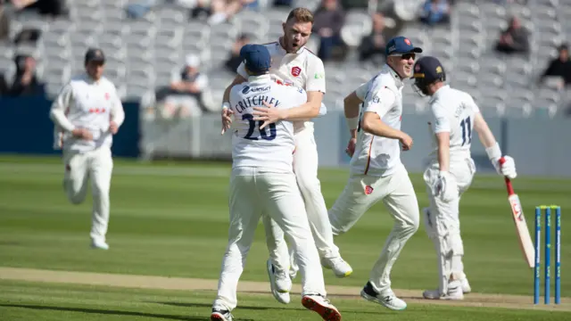 Sam Cook of Essex celebrates taking the wicket of Middlesex's Mark Stoneman