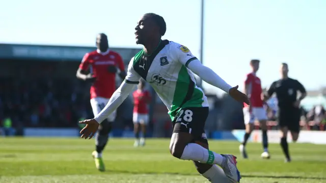 Jay Matete celebrates scoring Plymouth's third goal at Morecambe