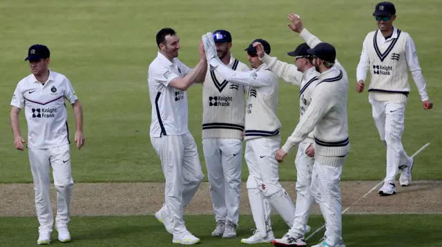 Toby Roland-Jones celebrates with his team-mates