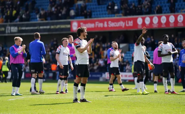 Luton players applaud their supporters