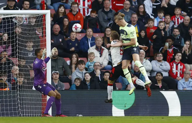 Erling Braut Haaland heads at goal